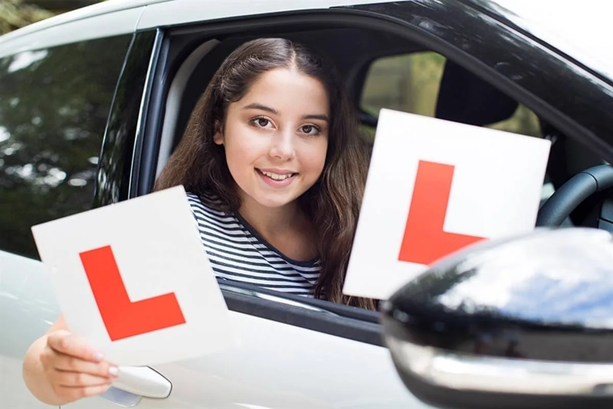 Learner driver with L plates during an automatic driving lesson in the Liverpool area